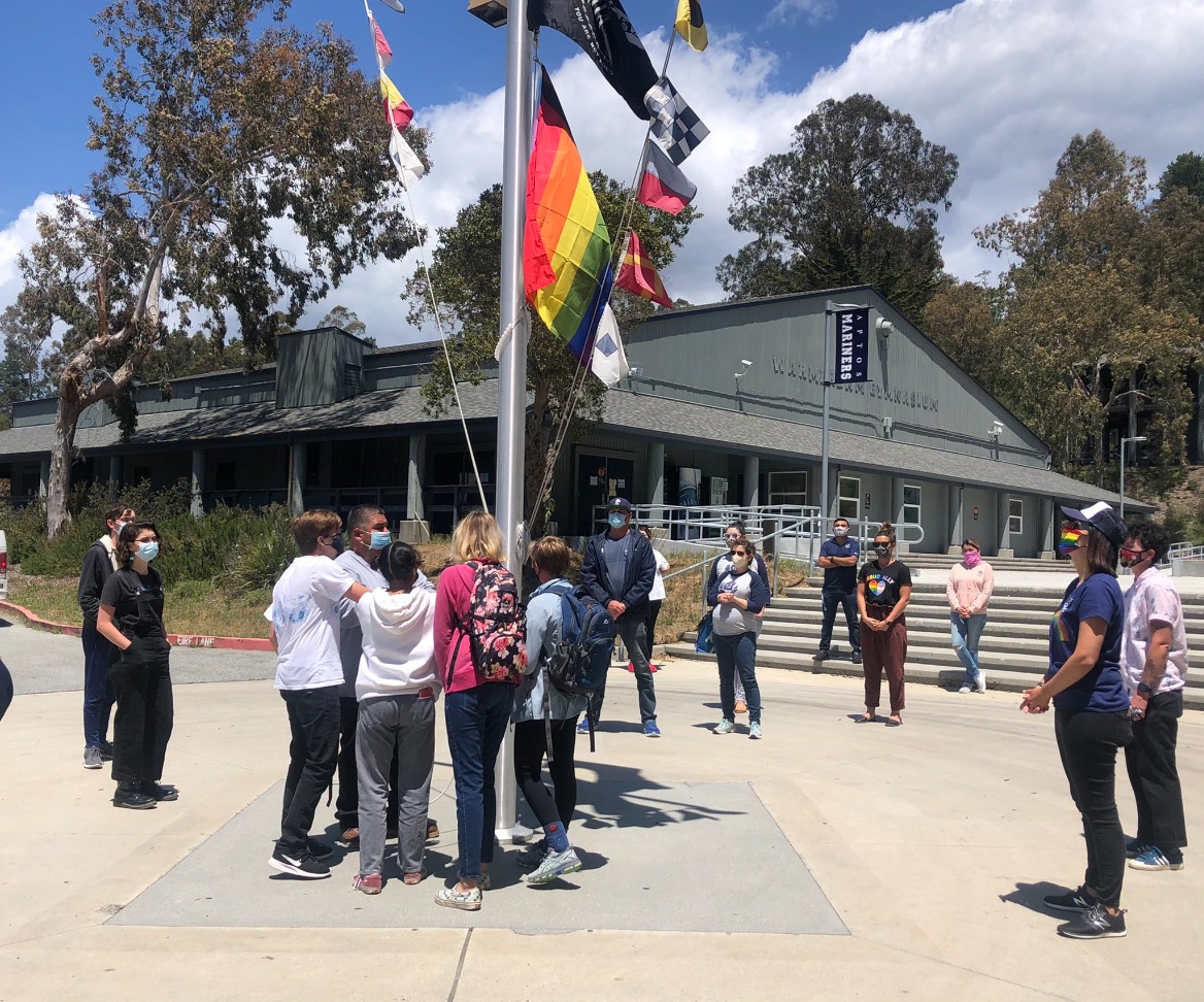 raising rainbow flag